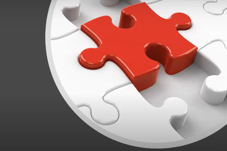 Puzzle with single red piece holding to parts together.